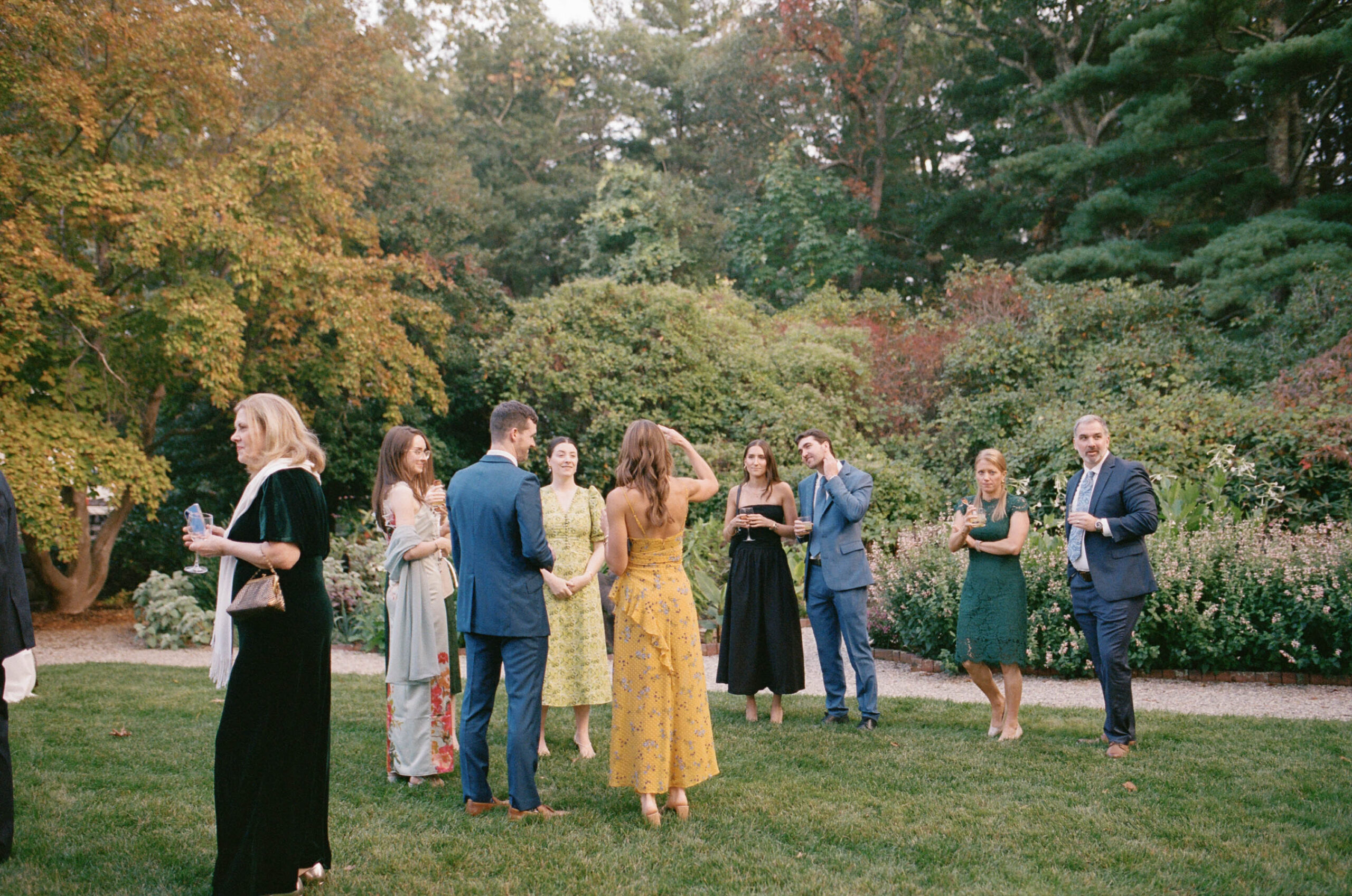 guests mingle at cocktail hour at the bradley estate in canton massachusetts at a wedding on film