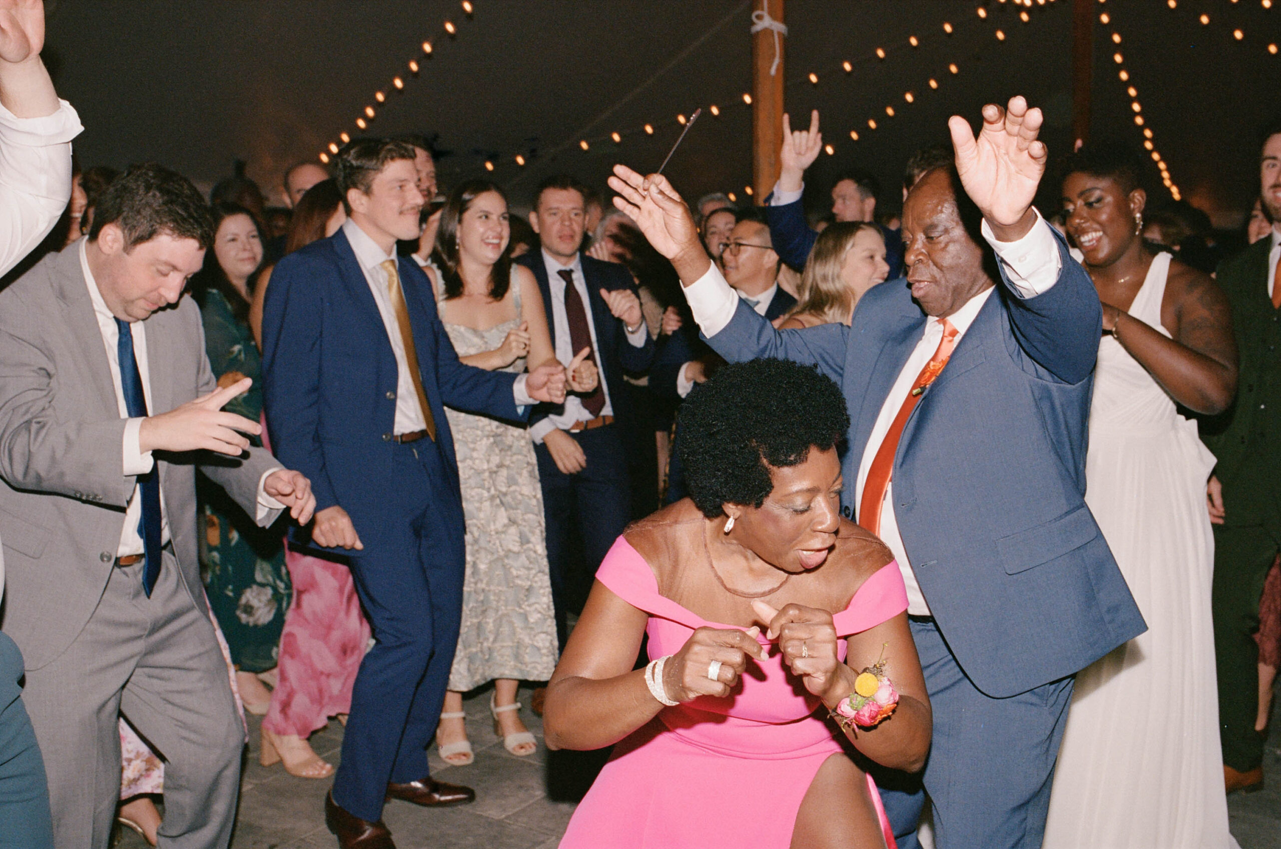 guests dance and party at the reception at the bradley estate in canton massachusetts at a wedding on film